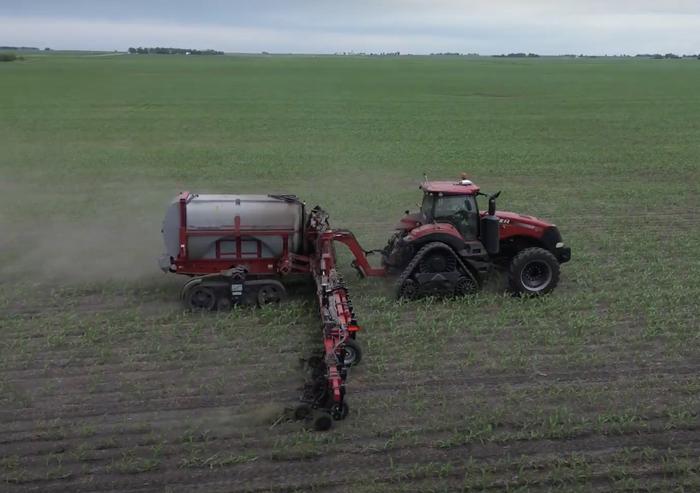 Farmer applying nitrogen fertilizer