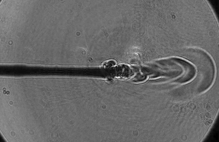 Revealing the Reason Behind Jet Formation at the Tip of Laser Optical Fiber