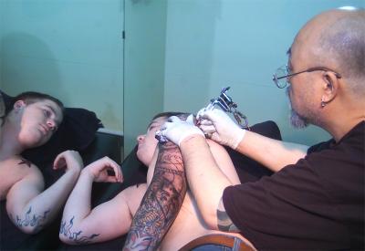 A Servicemember Receives a Tattoo in Japan