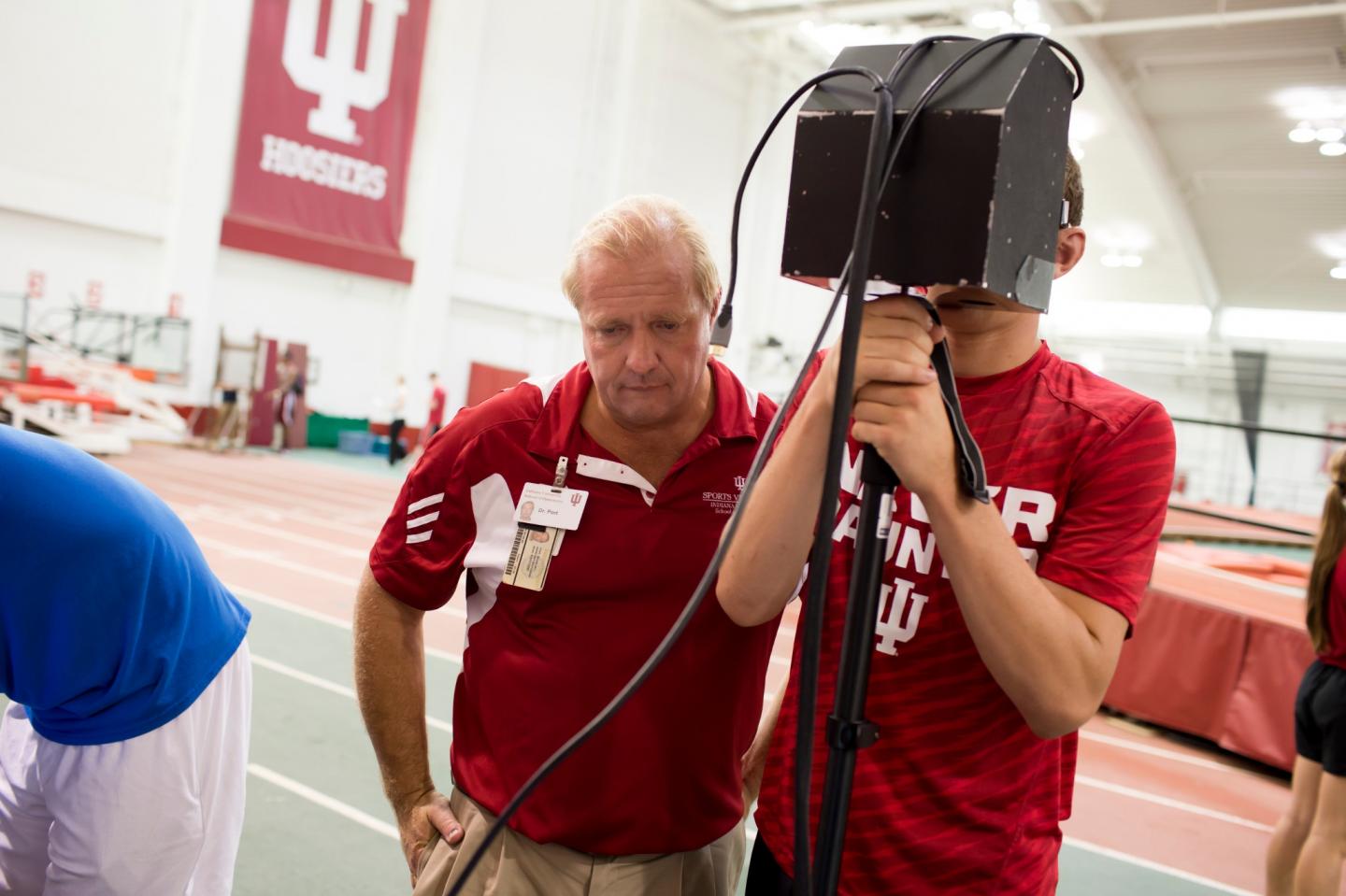 Nicholas Port Assesses An Athlete Using a Portable Eye-Tracking Device