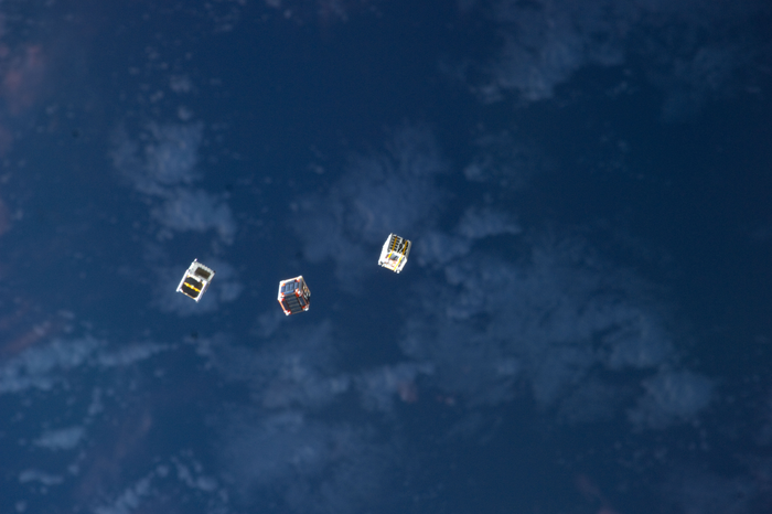 CubeSats in orbit above Earth.