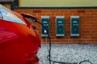 Energy-Positive Buildings -- Use Surplus Energy to Charge Your Electric Car