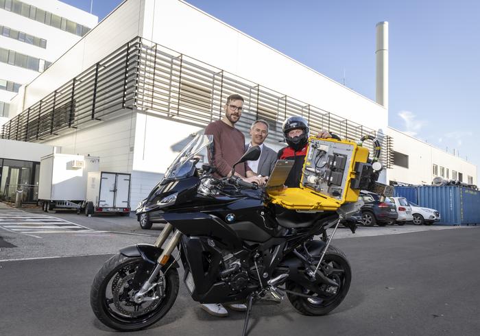 Part of the project team with the measuring device for motorcycles