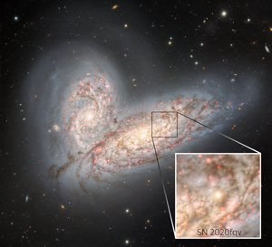 The merging galaxy pair NGC 4568 and NGC 4567 and supernova SN 2020fqv (callout box)