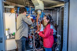 Scientists work on VENUS, the ion source where the titanium-50 beam is created