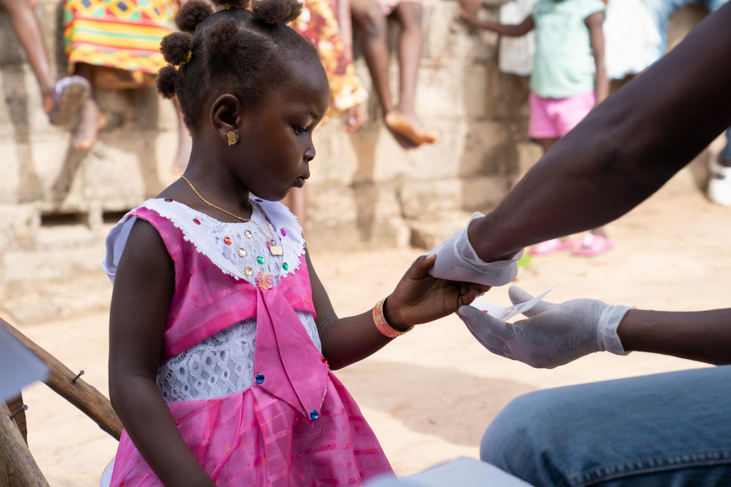 Girl getting tested for malaria