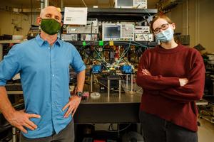 Matt Eichenfield, left, and Lisa Hackett, pictured in their lab at Sandia National Laboratories during the COVID-19 pandemic.
