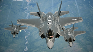 F-35A Lightning II aircraft receive fuel from a KC-10 Extender