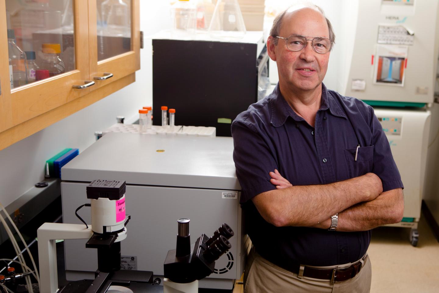 Michael Russell, PhD, standing in lab