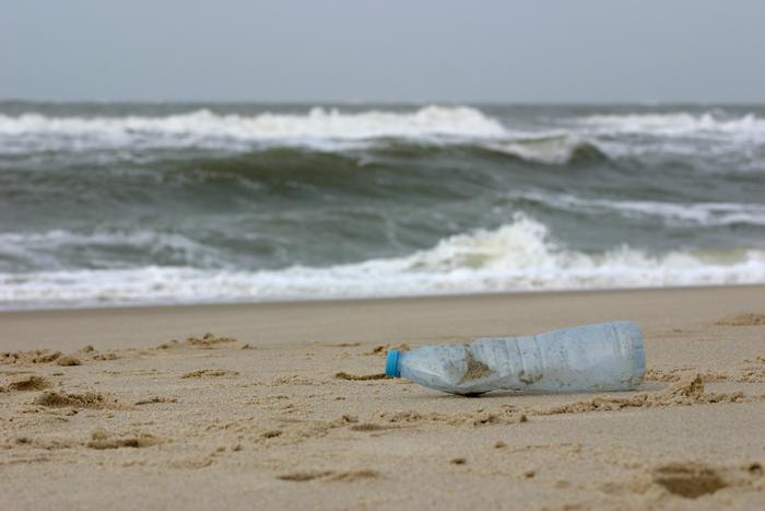 Plastic trash, washed ashore at the Sylt west beach, after a stormy night.