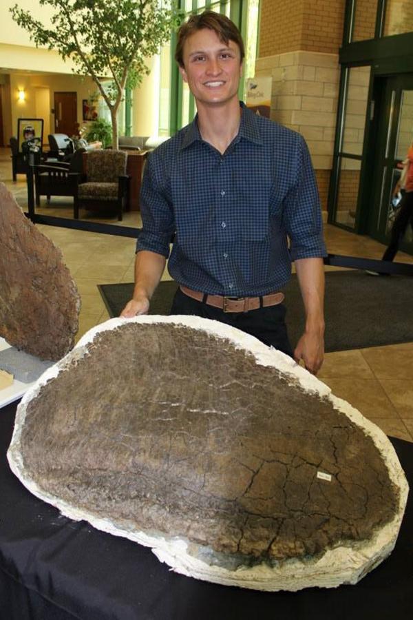 Evan Saitta with <i>Stegosaurus</i> Plates for Scanning