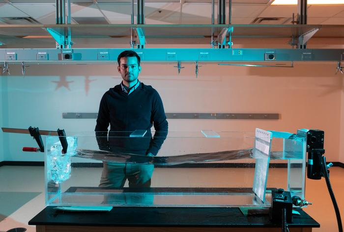 Alexander Robel sets up an experiment to study glacial melt.