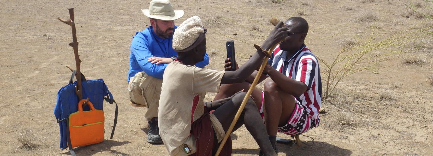 Matt Zefferman in the field observing an interview with Turkana community members.