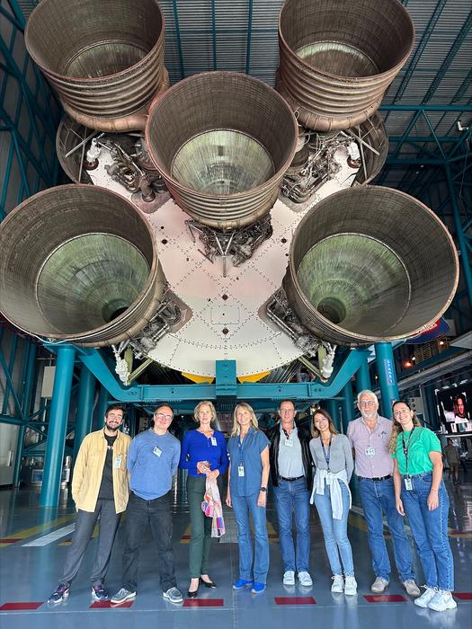 The entire Cerebral Ageing team in front of the historical Saturn V launch vehicle