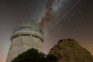 Trail left by BlueWalker 3 over Kitt Peak National Observatory