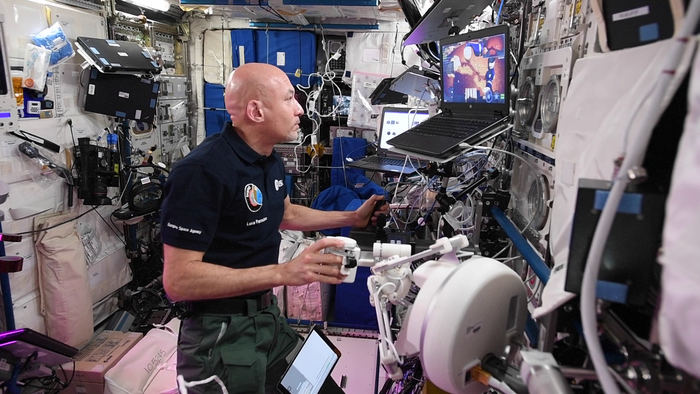 Astronaut Luca Parmitano operates the 'lunar rover' robot
