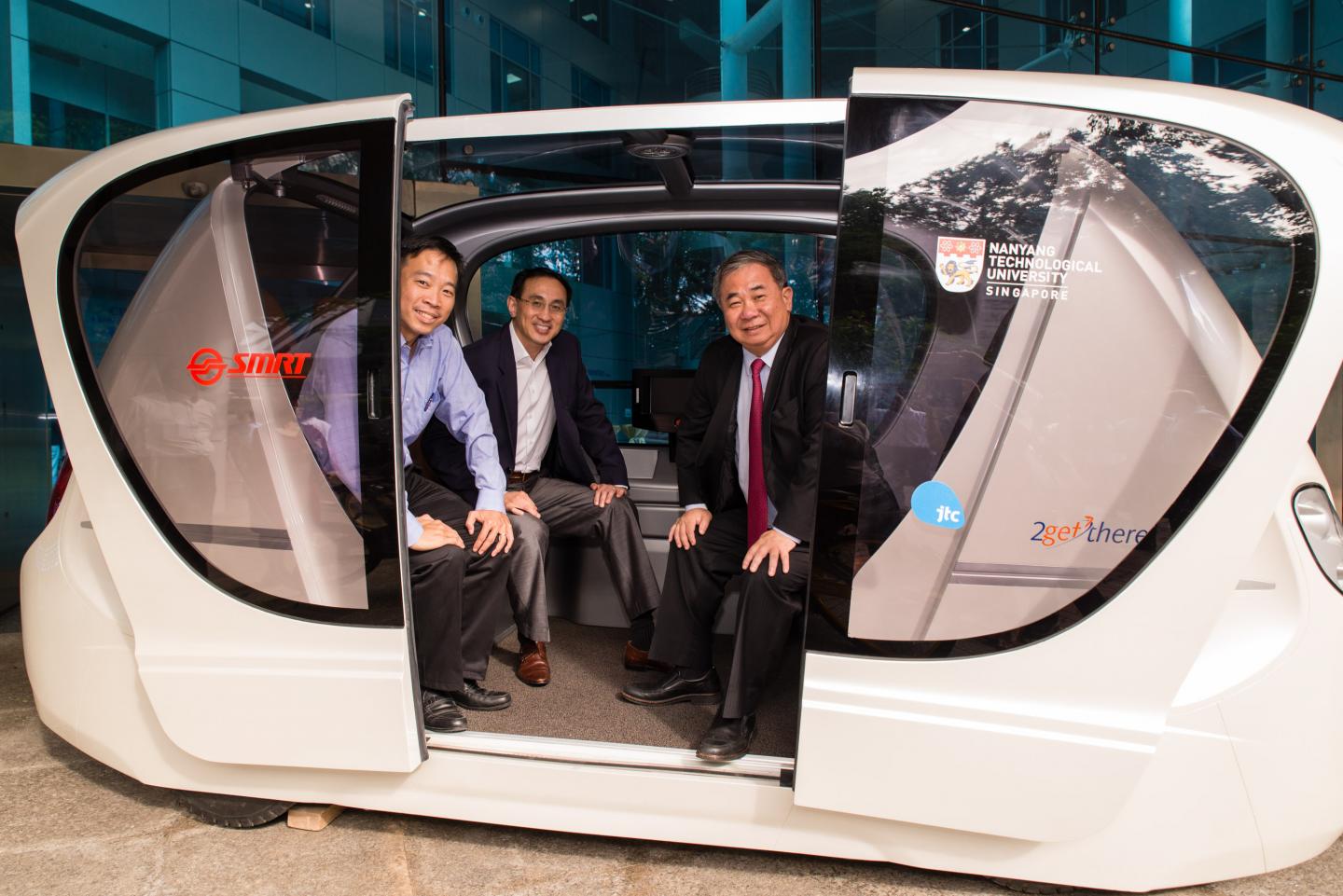 Senior management from NTU, SMRT and JTC in a Driverless Personal Rapid Transit Vehicle