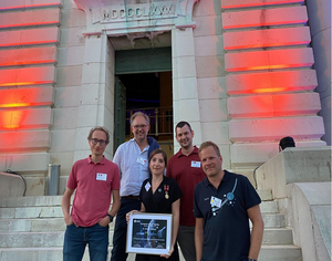 Sabina Raducan (center) and Martin Jutzi (right) with collaborators at the Hera Workshop in Nice, France.