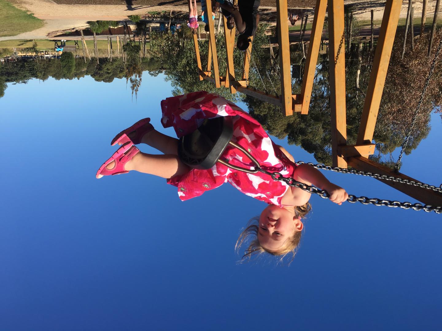 Sarah, who has achoondroplasia, enjoys the local swings