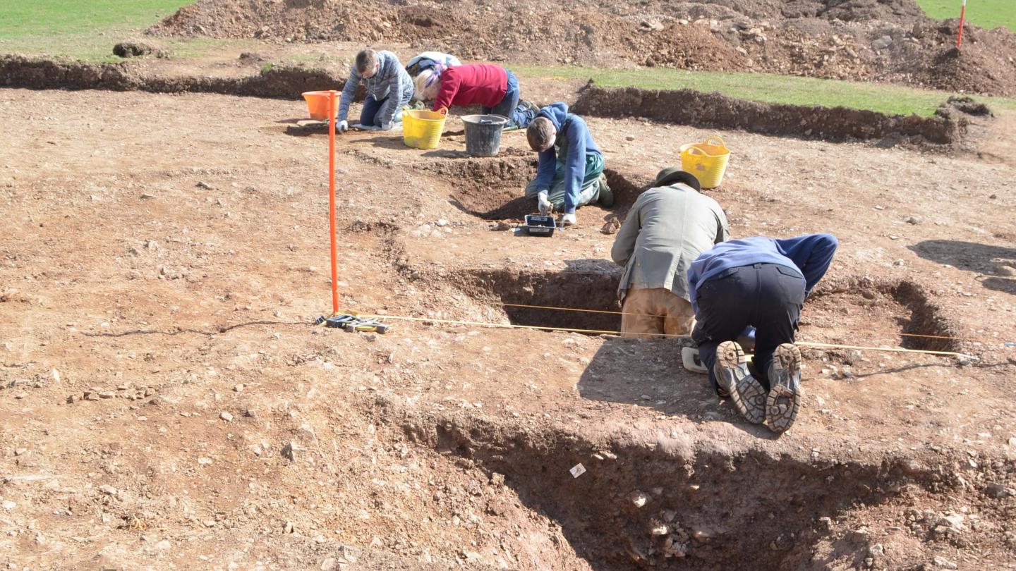 Human Cremation in Pottery Urn under Excavation