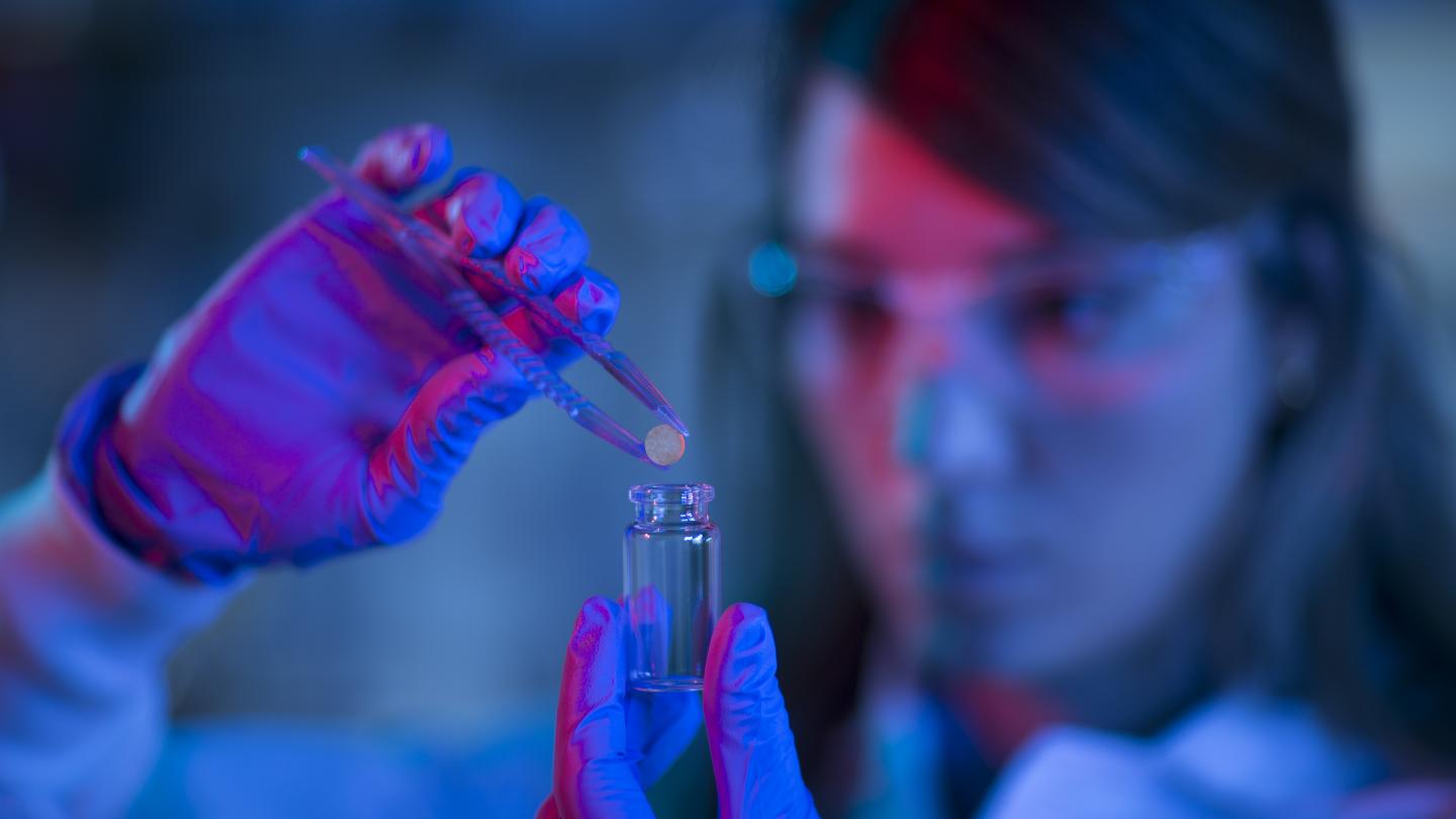 Researcher Holding Cancer Vaccine Scaffold