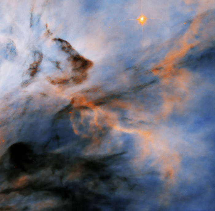 Hubble Finds Flame Nebula's Searing Stars May Halt Planet Formation