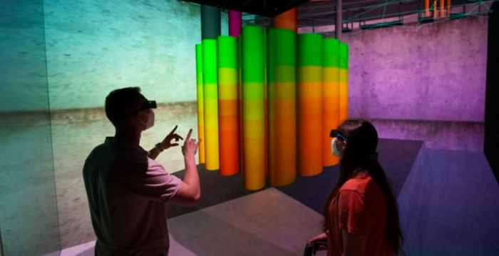 Students Cole Manfred (at left) and Emily Meilus inspect a virtual nuclear reactor using the RAPID system.
