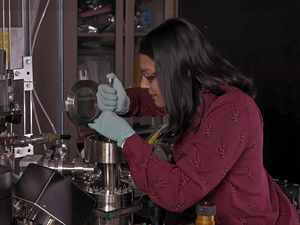 Sandra Taylor, a PNNL chemist, loads a sample into an atom probe tomography instrument.