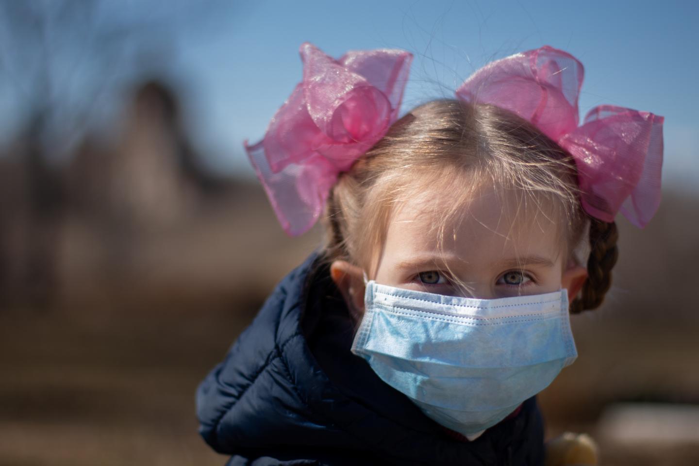 Child wearing protective mask