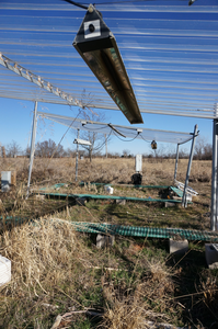 Researchers use a heater to simulate climate warming at a long-term multifactor experimental field site at the University of Oklahoma