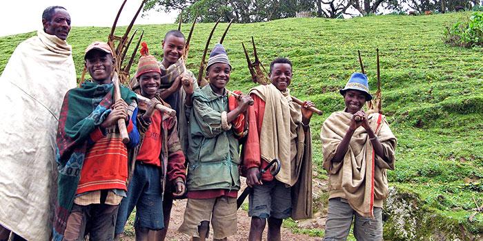 Young Men Work Together to Prepare Fields