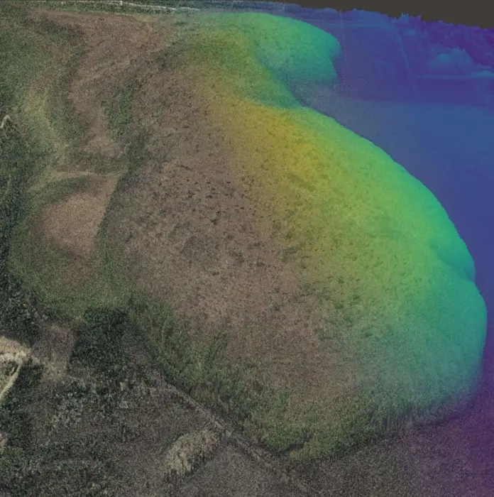The mounded shape of a raised bog (Valgeraba, Estonia) is revealed by a coloured relief map overlaid on aerial photography based on lidar data from the Estonian Land Board. Elevations are exaggerated to emphasise its mounded shape.