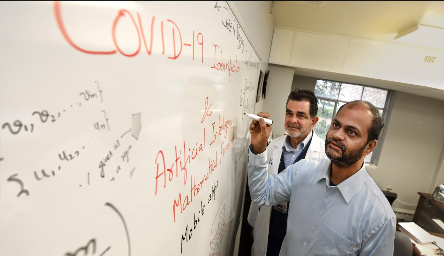 Drs. Arni Rao (foreground) and Jose Vazquez