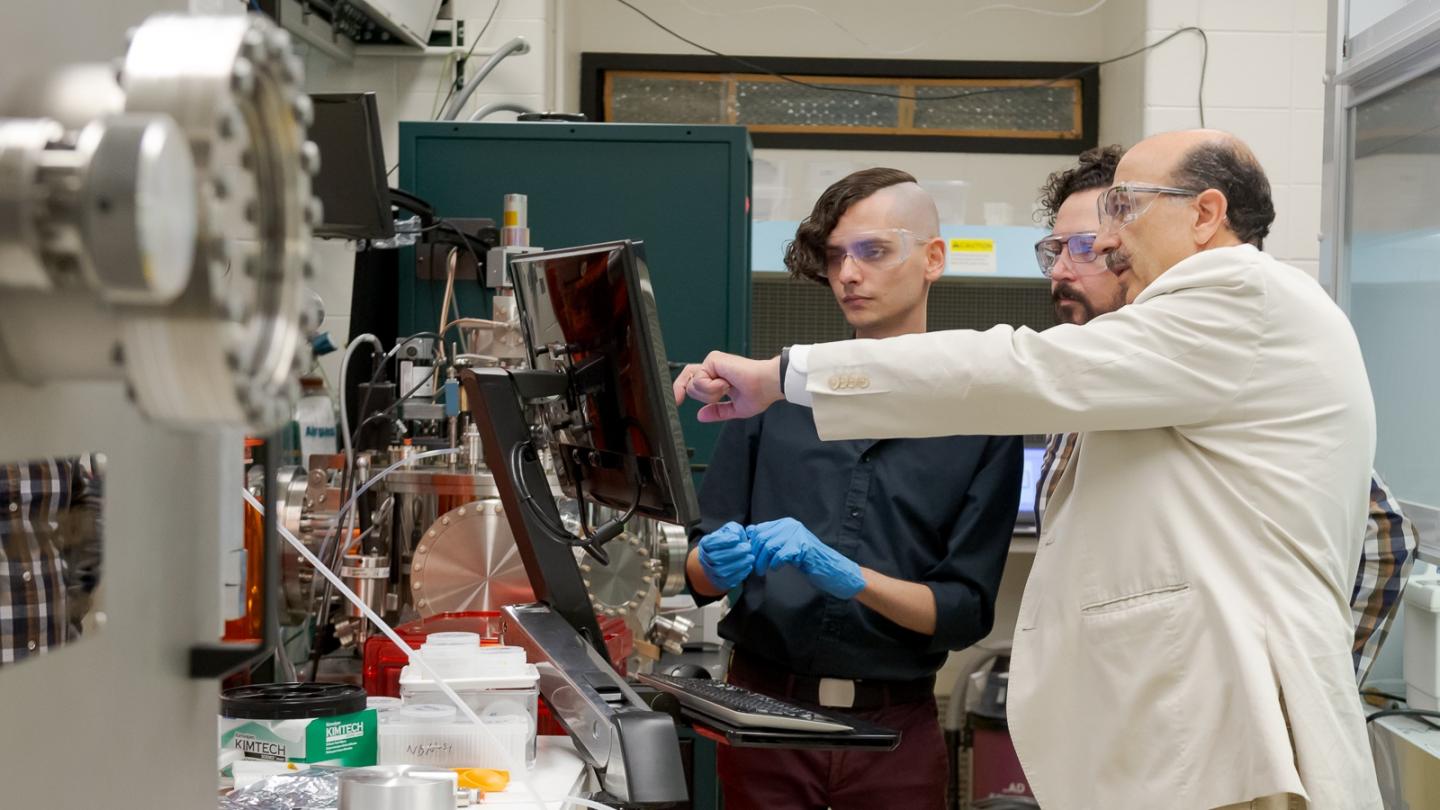Argonne scientists at nanowire fabrication machine