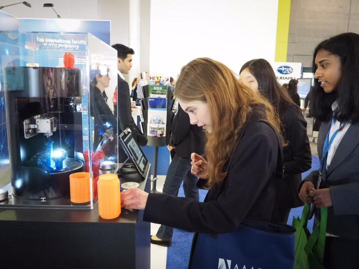 Visitors Looking at the World's First Compact Rotary 3-D Printer-cum-Scanner