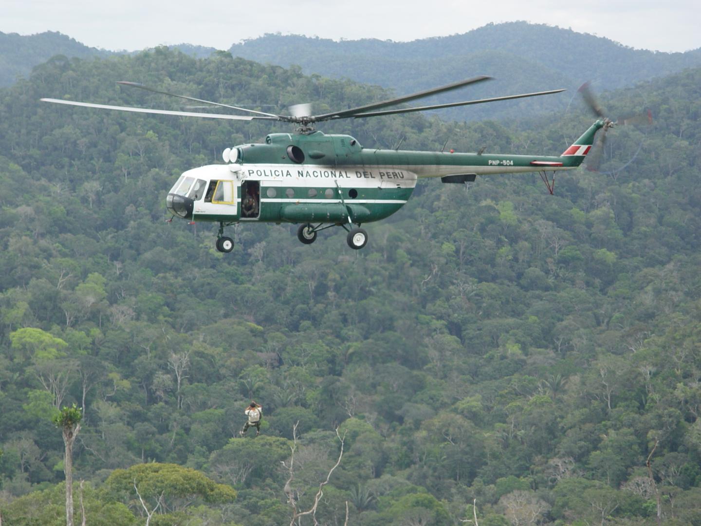 Scientist Suspended from Helicopter