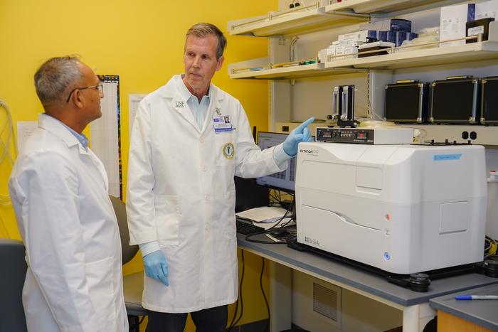 Timothy Yeatman and Ganesh Halade analyzing tumors