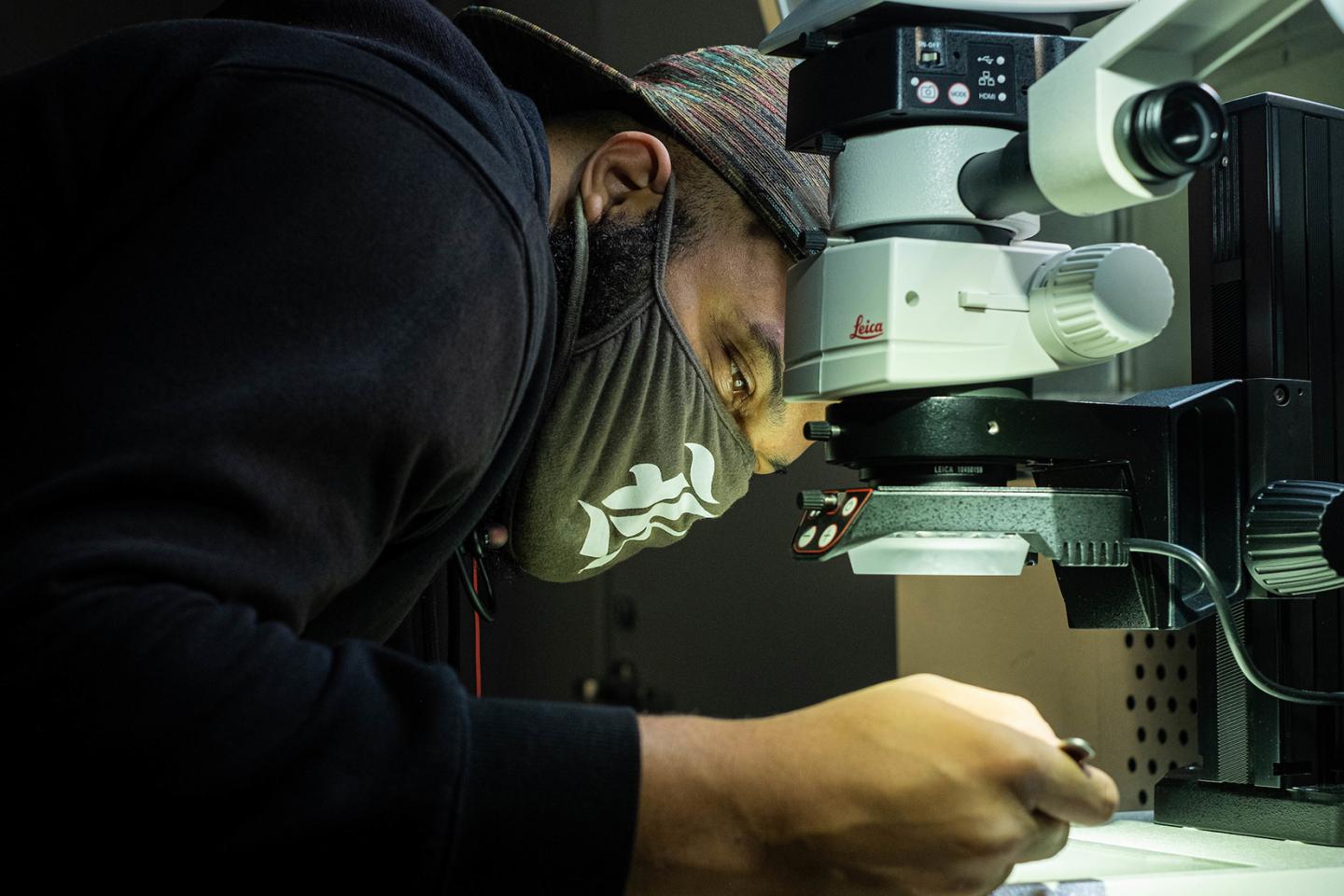 Kory Evans at microscope