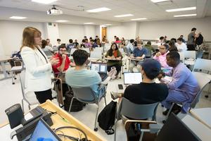 Binghamton University School of Management Associate Professor Tiffany Keller Hansbrough teaches a management course.