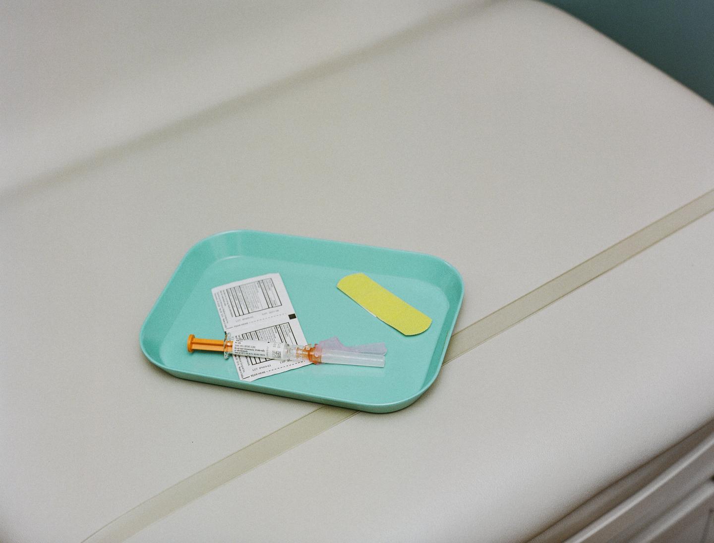 Vaccine on a Tray with Swabs and a Band-Aid