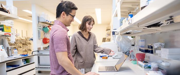 Dr. Evan Lien and Kelly Sokol in the lab at Van Andel Institute