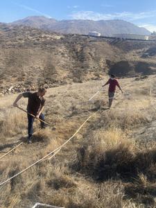 Students raking plots