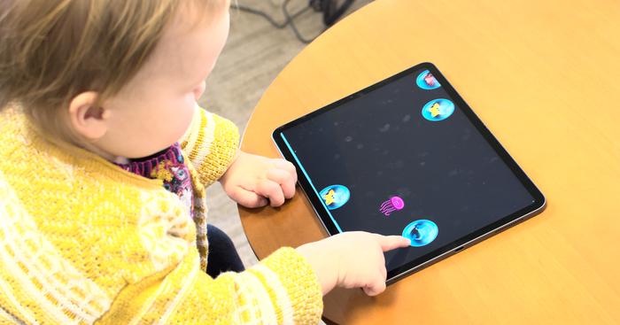 Toddler Playing Bubble Popping Game