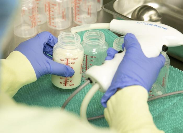 Machine used to fill bottles with pooled breast milk